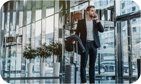 Man in lobby on cell phone